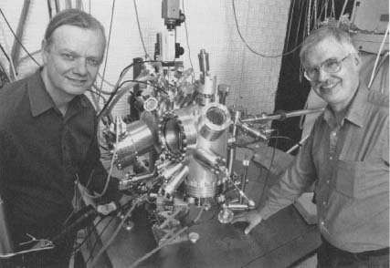 Two Hewlett-Packard scientists stand next to a scanning tunneling microscope at the Hewlett-Packard headquarters in Palo Alto, California, that is used as part of Hewlett-Packard's molecular electronics research. Reproduced by permission of AP/Wide World Photos.