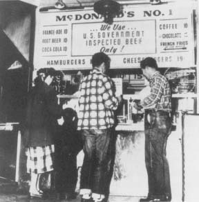 Customers lined up in front of the first McDonald's hamburger stand in San Bernadino, California, in 1948. Reproduced by permission of AP/Wide World Photos.