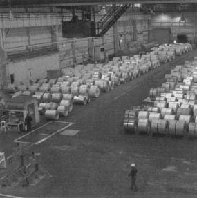 Rolls of flat rolled steel await shipment to customers at United States Steel's Mon Valley Works in West Mifflin, Pennsylvania. Reproduced by permission of AP/Wide World Photos.