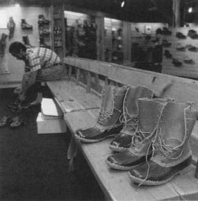 Waterproof "duck" boots sit on a bench in the fitting area of the shoe department in the Freeport, Maine, L.L. Bean store. Reproduced by permission of Corbis Corporation (Bellevue).