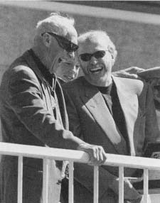 Nike CEO Phil Knight (right) shares a laugh with his former University of Oregon coach and Nike cofounder Bill Bowerman. Reproduced by permission of AP/Wide World Photos.